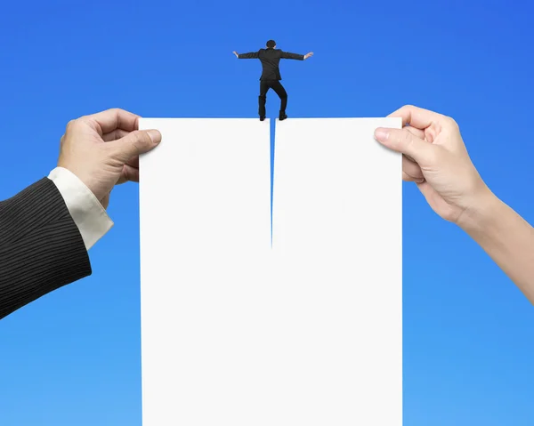 Man and woman hands tearing blank paper with businessman standin — Stock Photo, Image