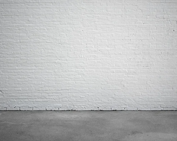 Wnętrza pokoju z białej cegły ściany i betonowe podłogi — Zdjęcie stockowe