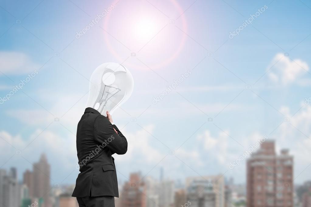 Man side view with lamp head thinking in sunny day