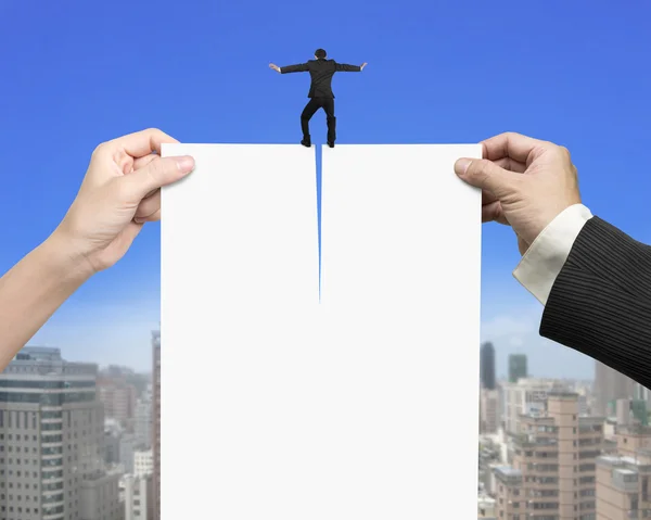 Man and woman hands tearing blank paper with businessman standin — Stock Photo, Image