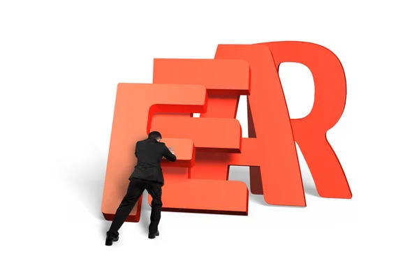 Man pushing domino of red fear word falling — Stock Photo, Image