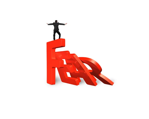 Affärsman balansera domino röd rädsla Word faller — Stockfoto