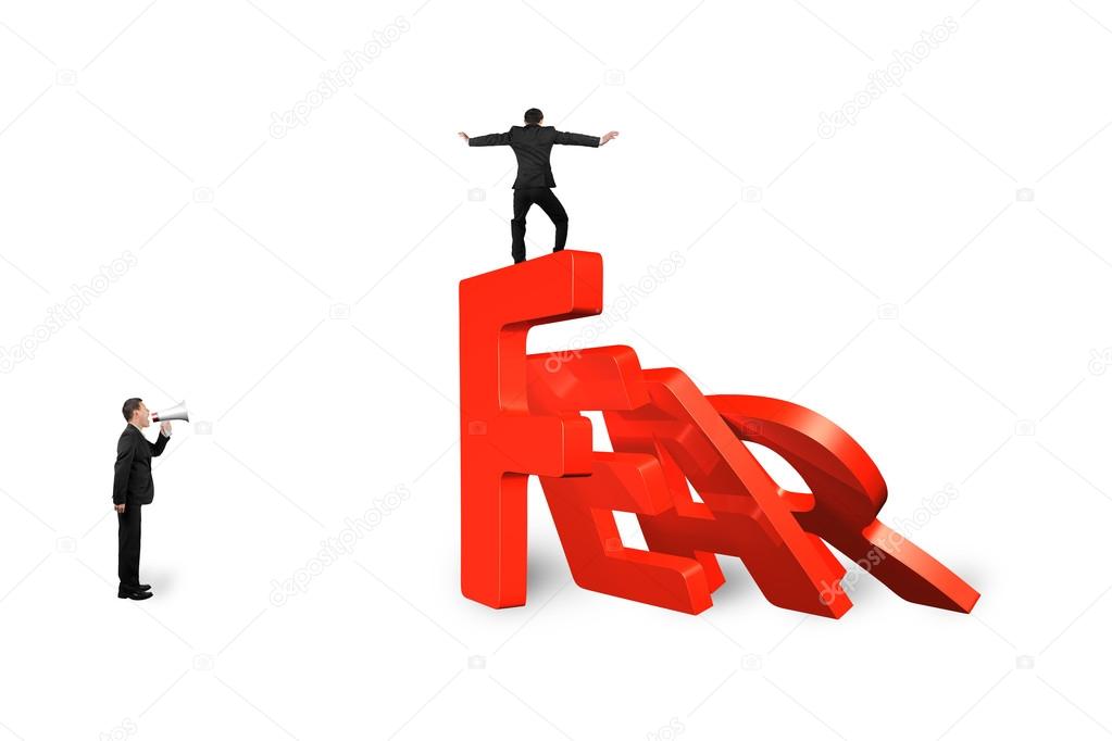 Man balancing on fear word domino falling with another shouting