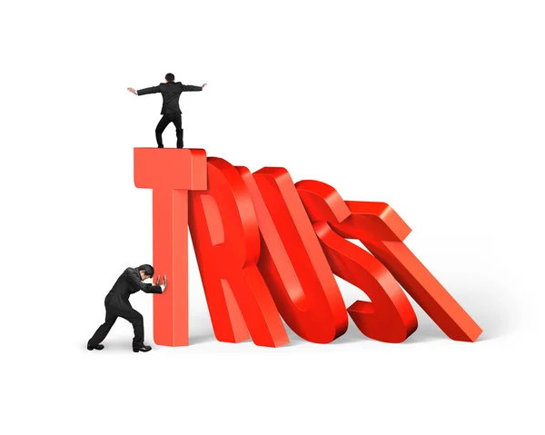 Man stopping trust domino falling with another balancing on it — Stock Photo, Image