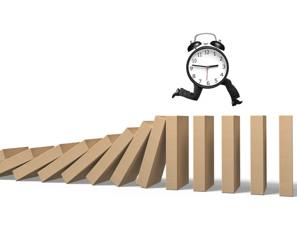 Alarm clock with human legs running on falling dominoes — Stock Photo, Image