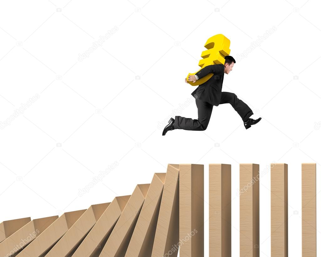 Man carrying Euro sign running on falling wooden dominos