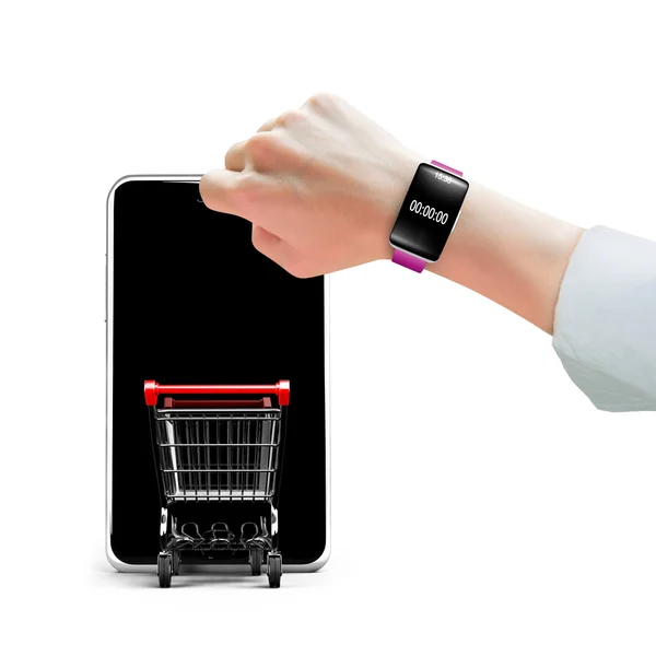 手戴智能手表与购物车进入智能手机 — 图库照片