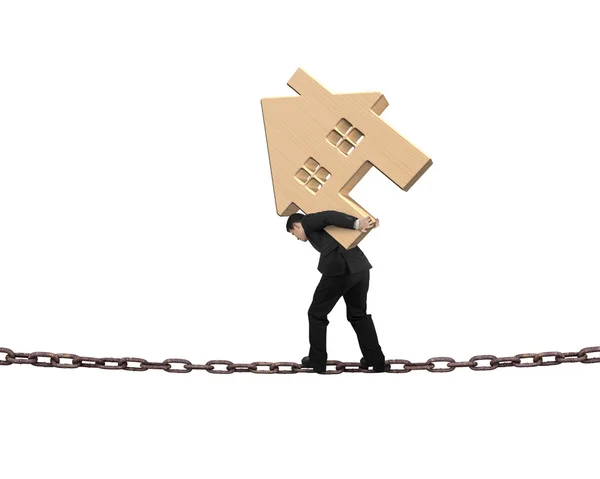 Businessman carrying wooden house balancing on chain — Stock Photo, Image