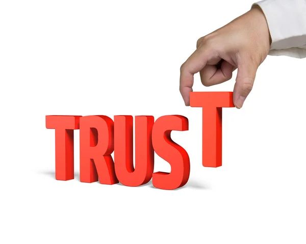 Hand holding T and putting Trust word together — Stock Photo, Image