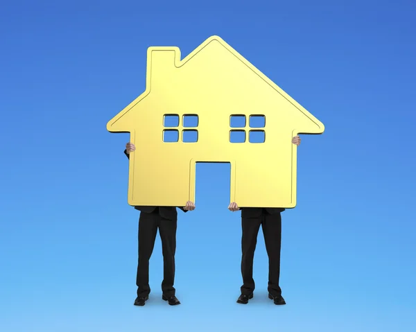 Two businessmen holding gold house together — Stock Photo, Image