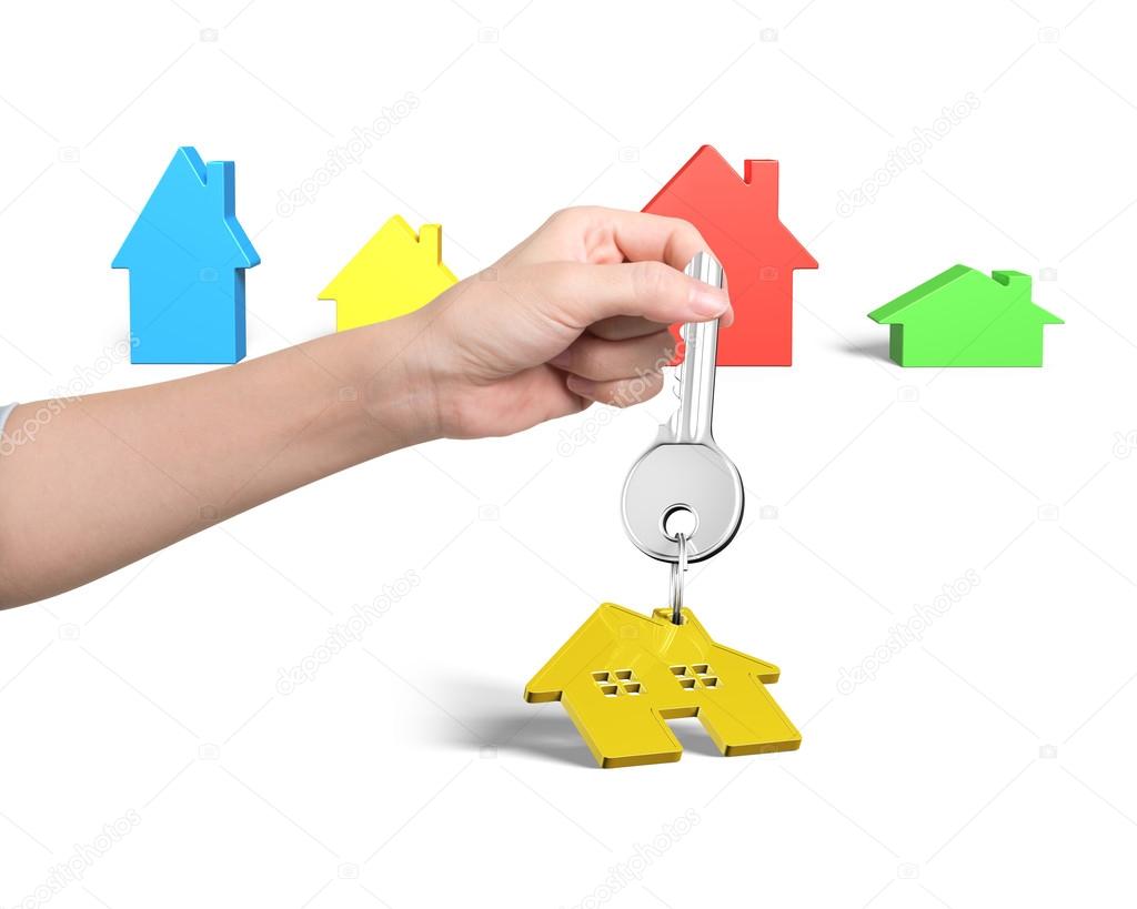 Woman hand holding key with house shape keyring