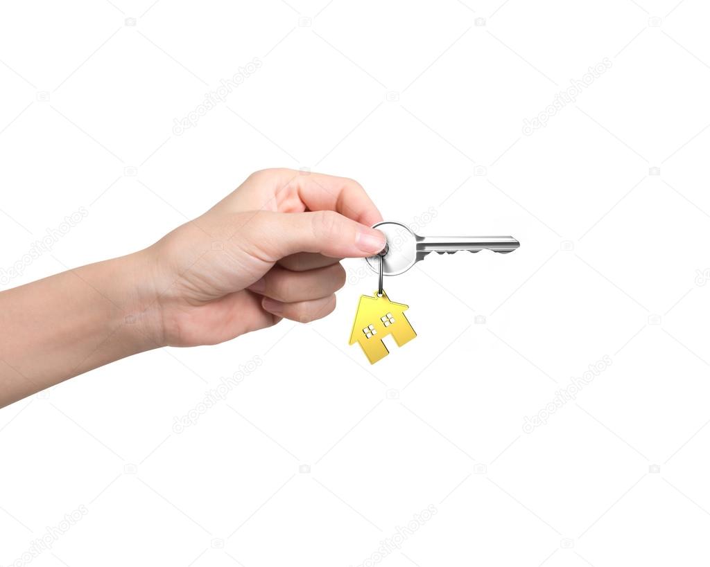 Woman hand holding key with house shape key ring