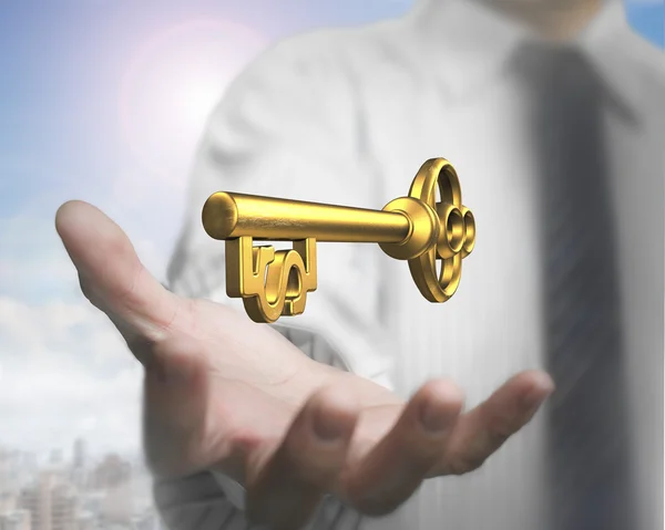 Man palm holding dollar shape golden treasure key. — Stock Photo, Image