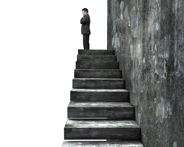 Side view of man standing on top of concrete stairs, isolated on white background.