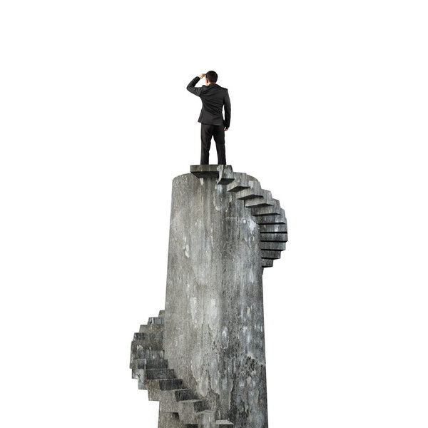 Businessman gazing on top of concrete spiral tower, isolated on white background.