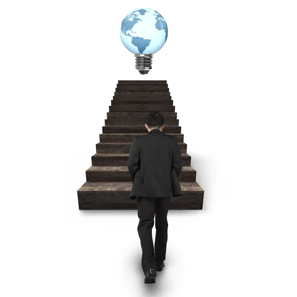 Man walking toward light bulb of globe shape on stairs — Stock Photo, Image