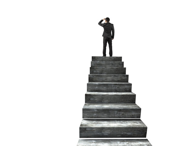 Businessman gazing on top of concrete stairs, isolated on white background.