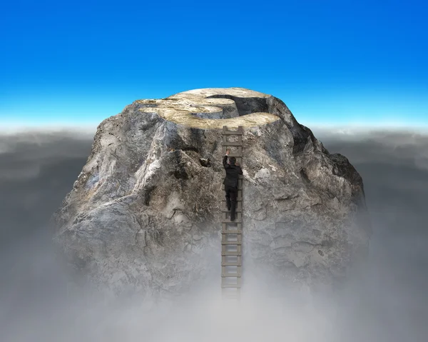 Climbing to top of euro symbol shape rocky mountain — Stock Photo, Image
