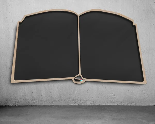 Empty book shape blackboard on wall — Stock Photo, Image