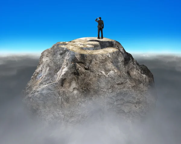 Gazing on top of euro symbol shape rocky mountain — Stock Photo, Image