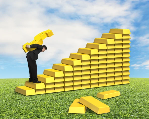 Carrying golden money symbol on gold stairs — Stock Photo, Image