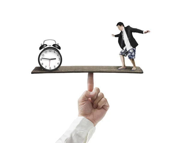 Equilibrio contra reloj despertador aislado en blanco —  Fotos de Stock