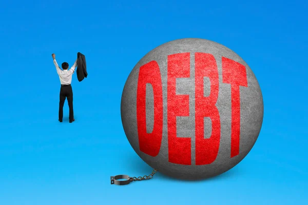 Cheering man free from debt ball shackle — Stock Photo, Image