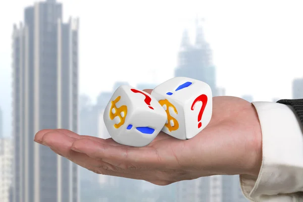 Hand giving two white dices — Stock Photo, Image