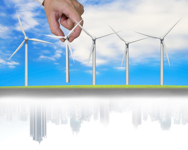 man hand holding windmills in a line