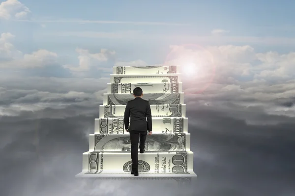 Businessman climb on money stairs with natural sunlight cloudsca — Stock Photo, Image