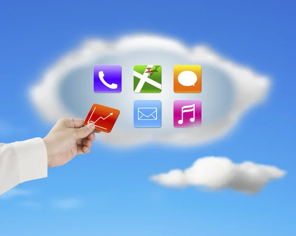 Hand taking away app icon from cloud with nature sky — Stock Photo, Image
