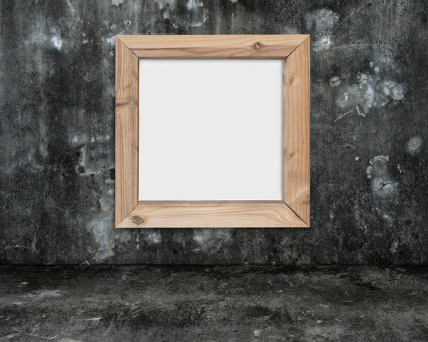 Quadro branco em branco com moldura de madeira na sala de concreto manchado escuro — Fotografia de Stock