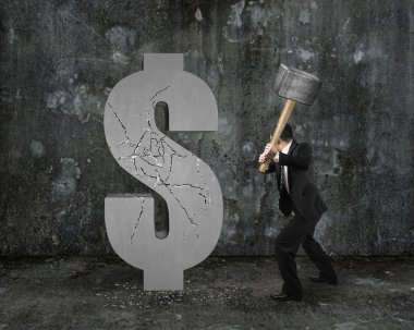 businessman holding hammer hitting cracked dollar sign with mott