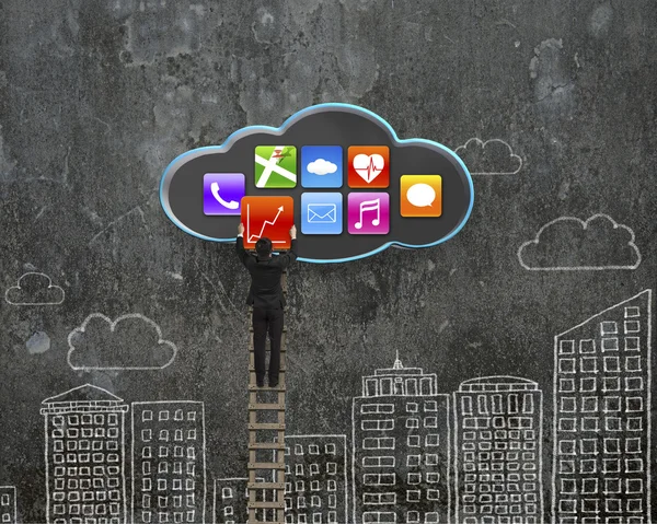 Climbing businessman get app icon from black cloud — Stok fotoğraf