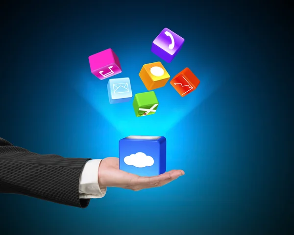 Mão mostrando caixa de nuvem ícones de aplicativos iluminados isolados em azul — Fotografia de Stock