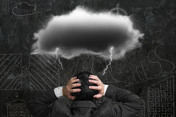 Depressed businessman with dark cloud rain lightning over his he — Stockfoto