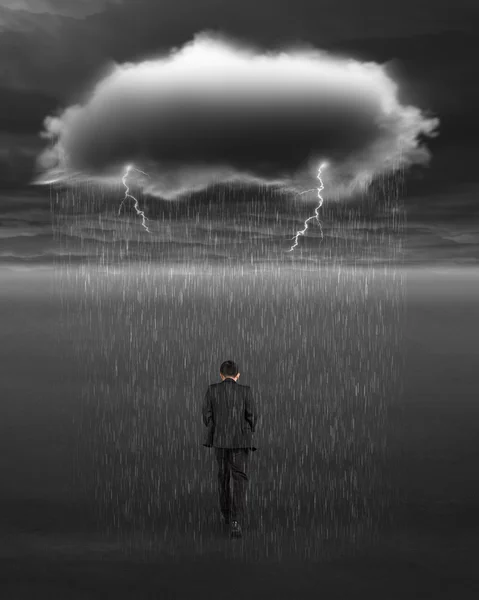 Depressed businessman walking with dark cloud of rain and lightn — Stockfoto