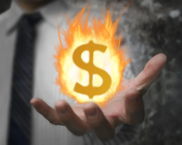 Feuerball mit Dollarzeichen in der Hand eines Geschäftsmannes — Stockfoto