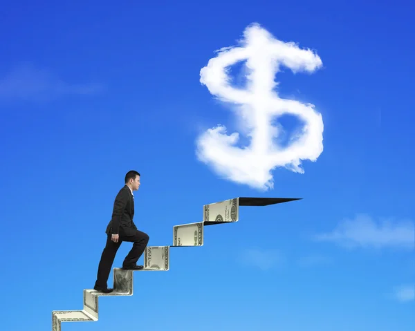 Businessman climbing on money stairs with dollar sign shape clou — Zdjęcie stockowe