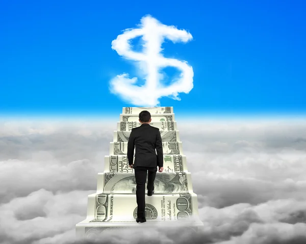 Businessman climbing the money stairs with dollar sign shape clo — Stock fotografie