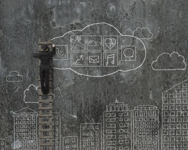 Man climbing and drawing cloud app icons doodles — Stock Photo, Image