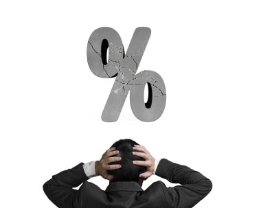 Businessman holding head with cracked percentage sign isolated o