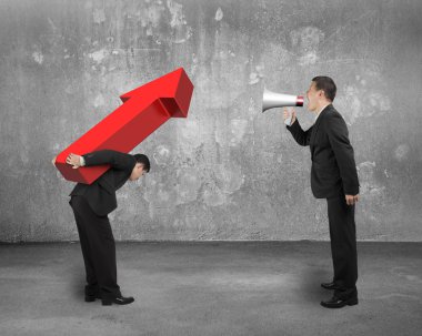 Boss using megaphone shouting at employee carrying red arrow sig