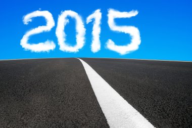 2015 year shape cloud with asphalt road and separation line