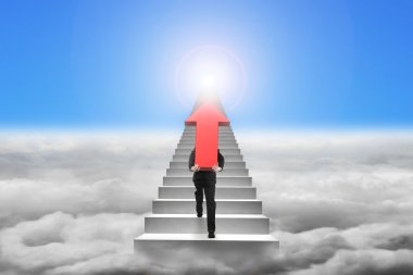Businessman carrying red arrow sign on stairs with cloudscape su