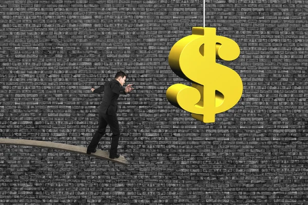 Businessman balancing on wooden board with golden dollar sign — Stok fotoğraf