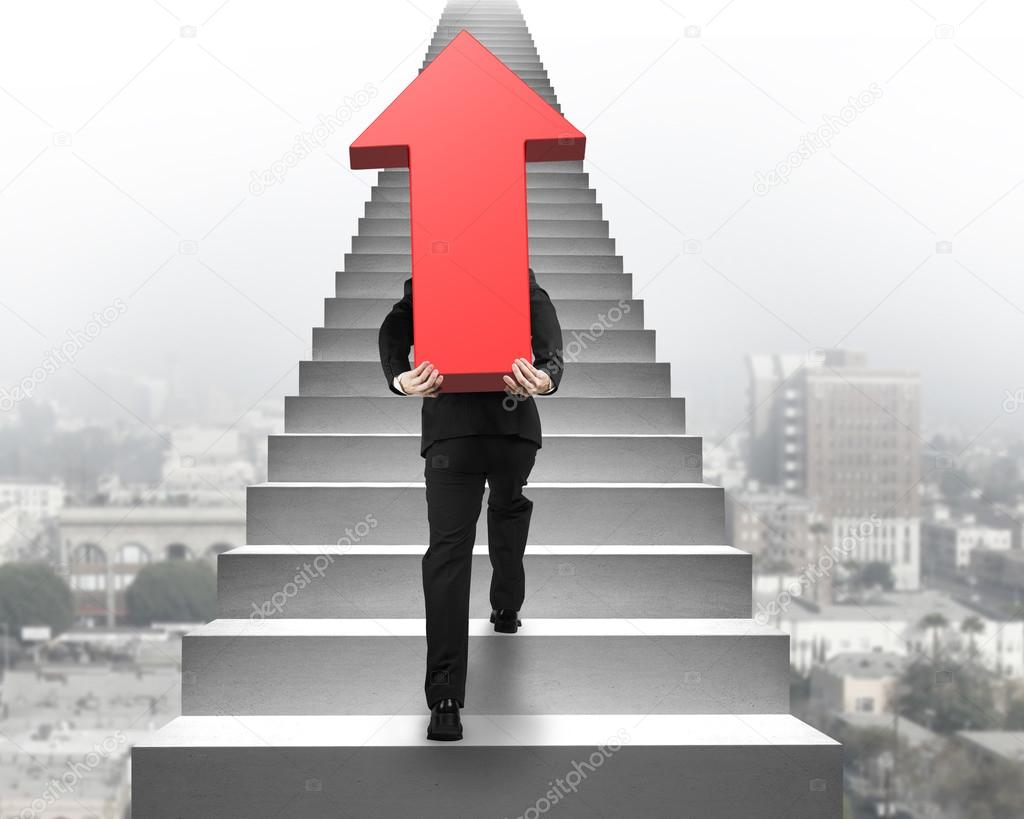 Businessman carrying red arrow sign on stairs with urban scene