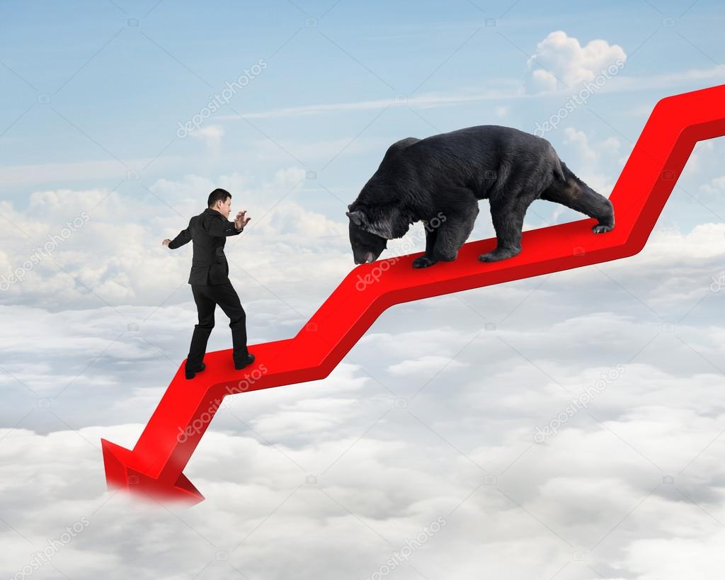 Businessman against bear on arrow downward trend line with sky