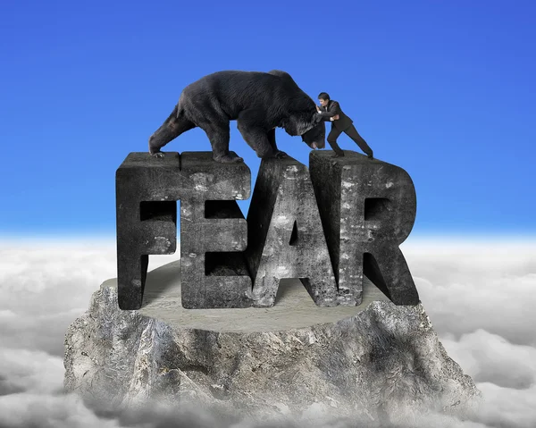 Businessman fighting against black bear on fear 3d concrete word — Stockfoto