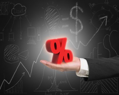 Hand showing 3D red percentage sign with business doodles blackb